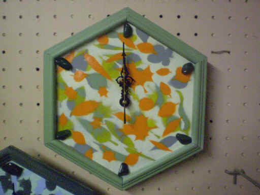 10inch (diagonal) wall clock. Artfully painted woo