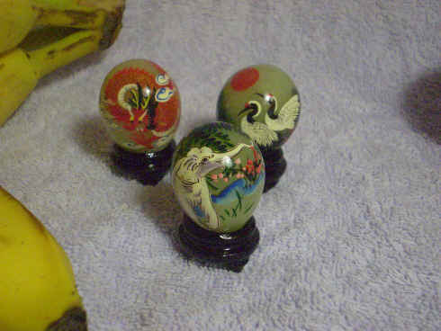 Hand-painted serpentine eggs with lacquered wooden