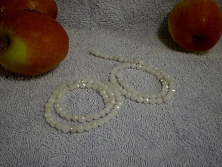 White quartz beads, faceted.