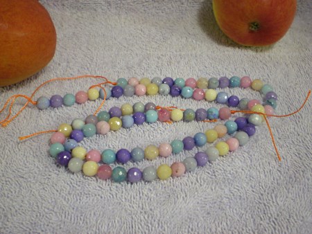 Faceted round beads, assorted colors.