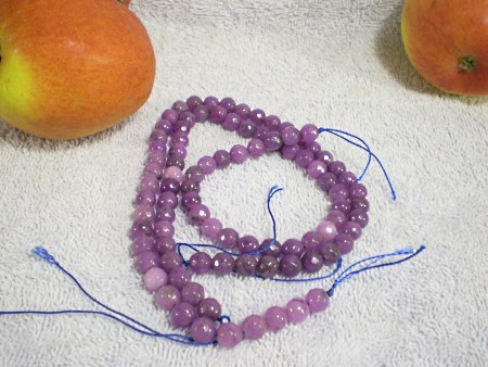 Faceted round amethyst beads.