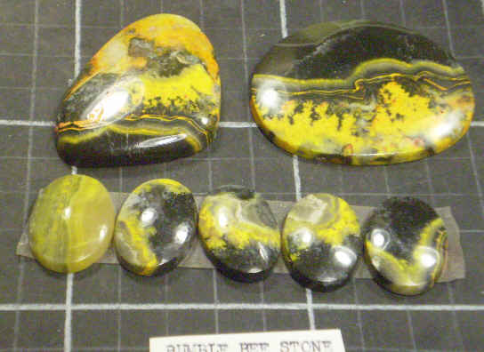 Cabochons of bumble bee stone.